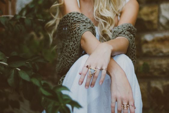 Woman Sitting with Arms Crossed