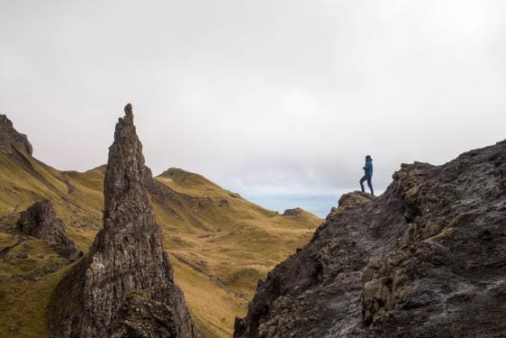 Person Standing on Cliff